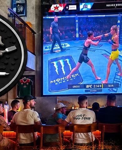 Fans watching UFC on the big screen at Fox & Rabbit